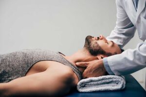 Person gently stretching a knee while examining a painless joint pop in a bright home setting.